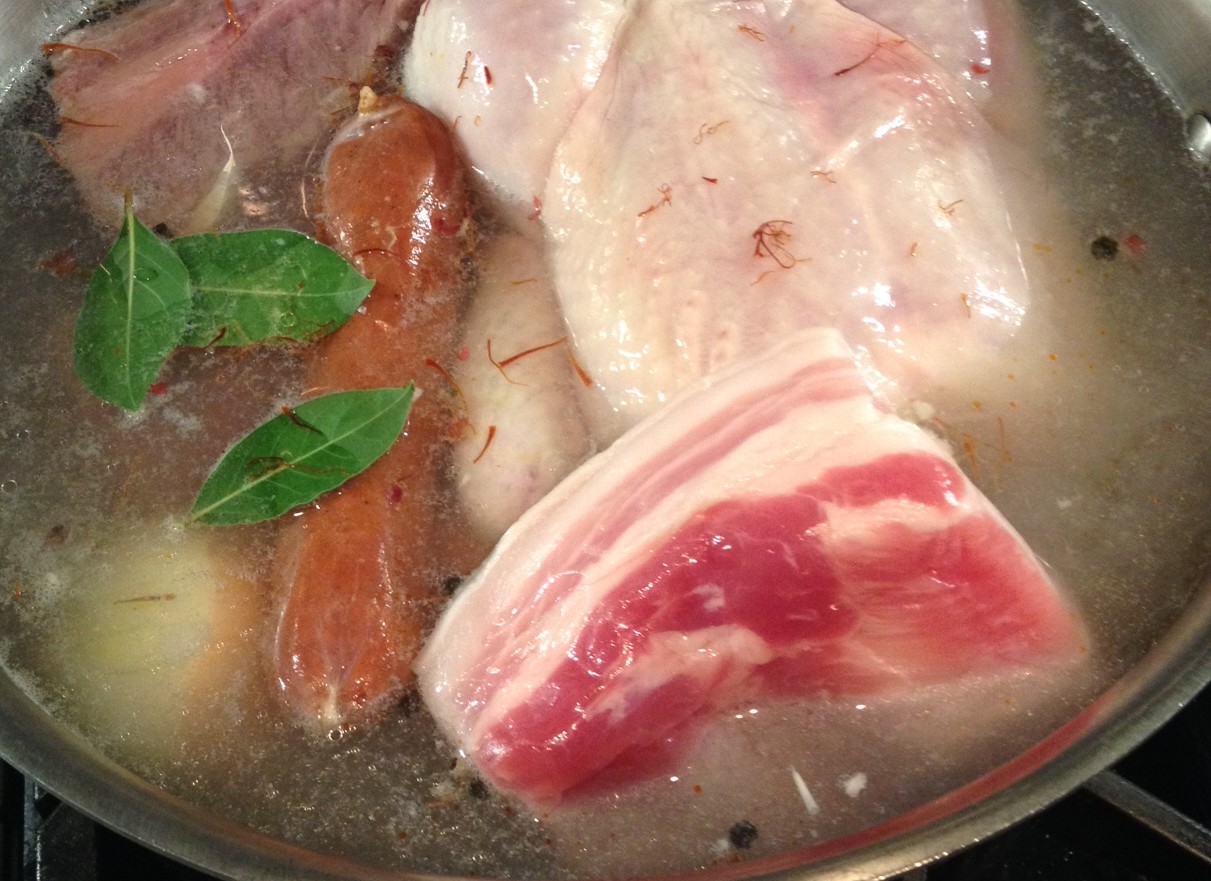 This classic Spanish garbanzo bean stew begins with a stock made from pork, beef, and chicken