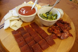 Appetizers including pickled Mexican cucumbers and tomato jelly