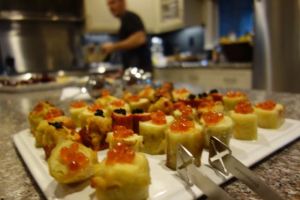 Banana peppers stuffed with tortilla de patata, garnished with caviar and salmon roe
