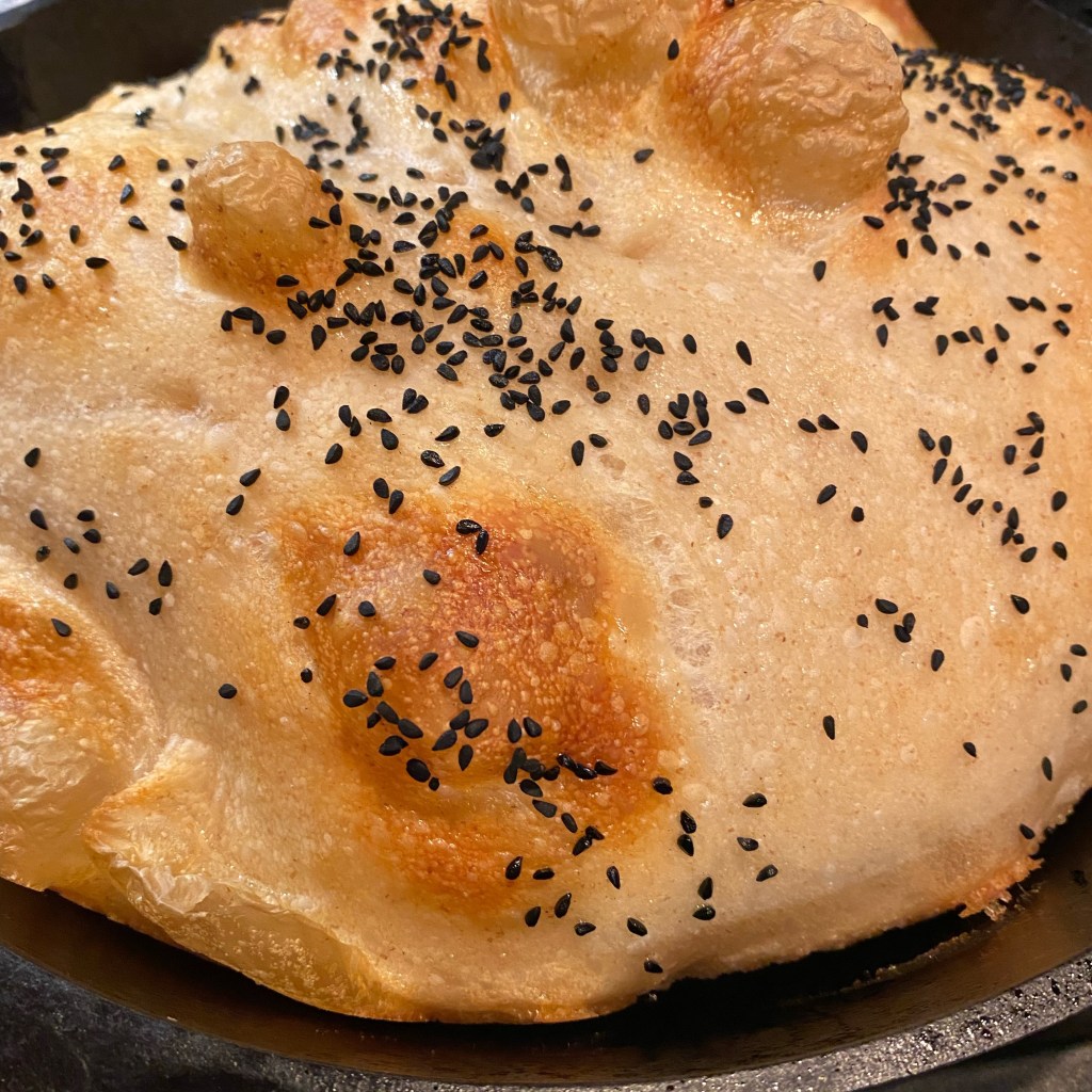 sourdough topped with black seed (nigella) and baked in a cast iron pan
